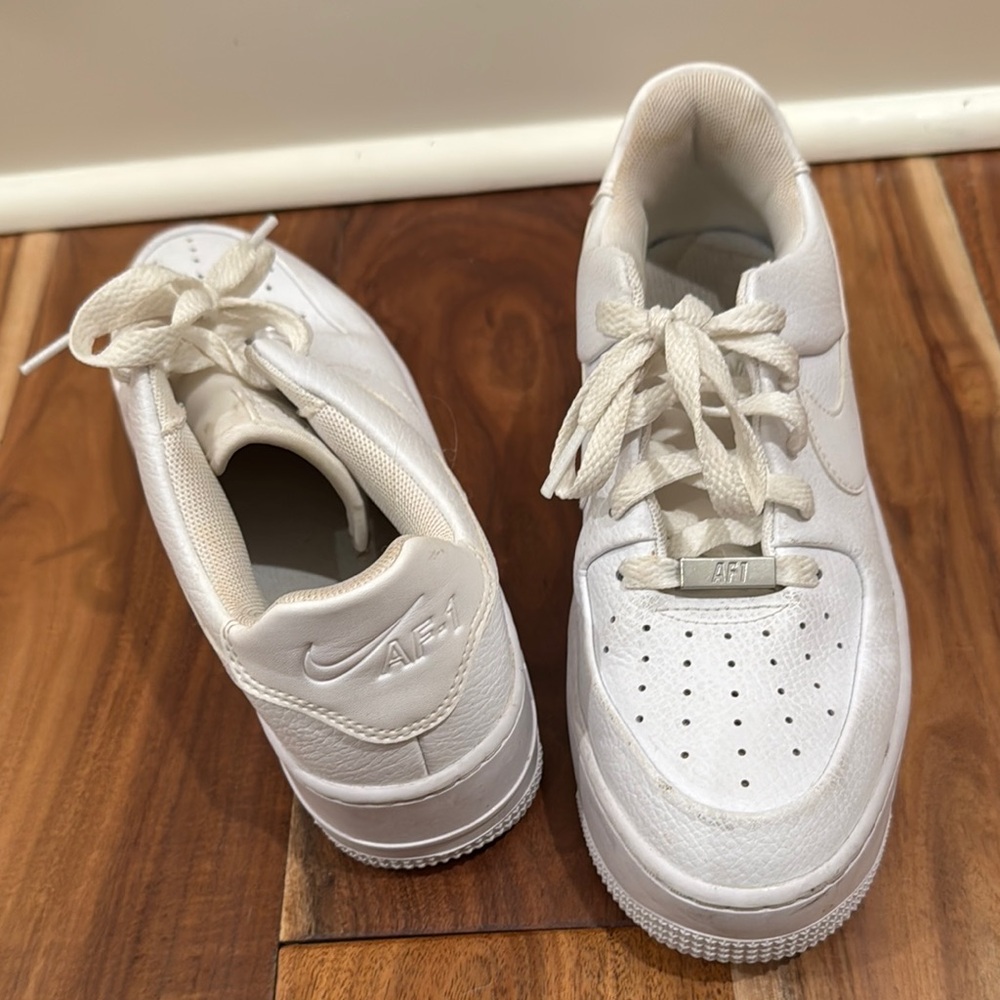 Nike White Sneakers with Smooth Leather Upper and Thick Rubber Sole